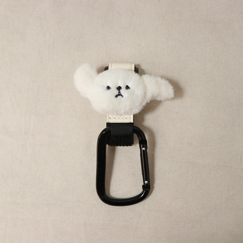 ホワイトでふわふわな毛並みが特徴的な、子犬モチーフのペットカートフック単体写真。つぶらな瞳が可愛い、正面からのクローズアップ。